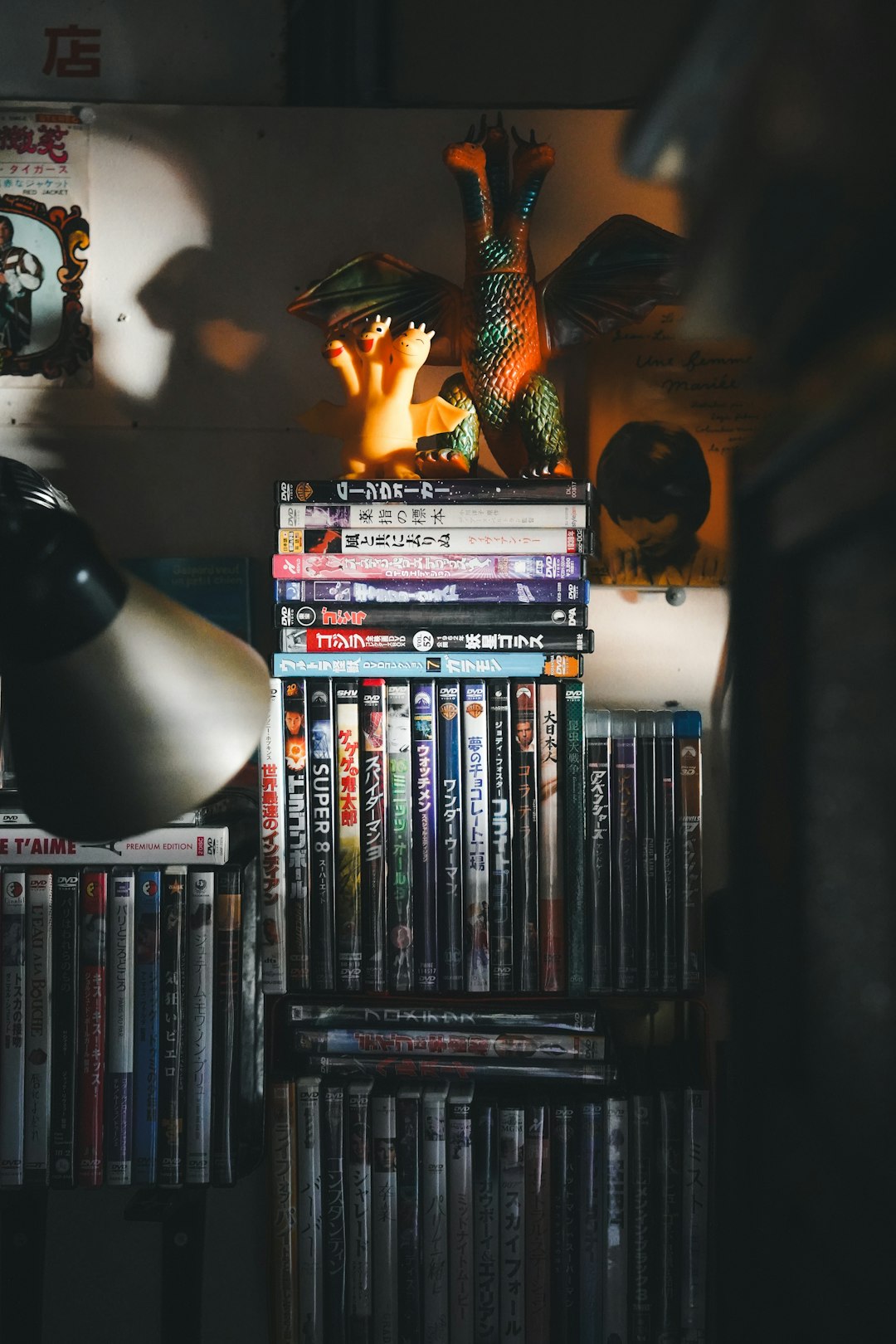 a-stack-of-dvds-sitting-on-top-of-a-table-9mzzut9ycn8